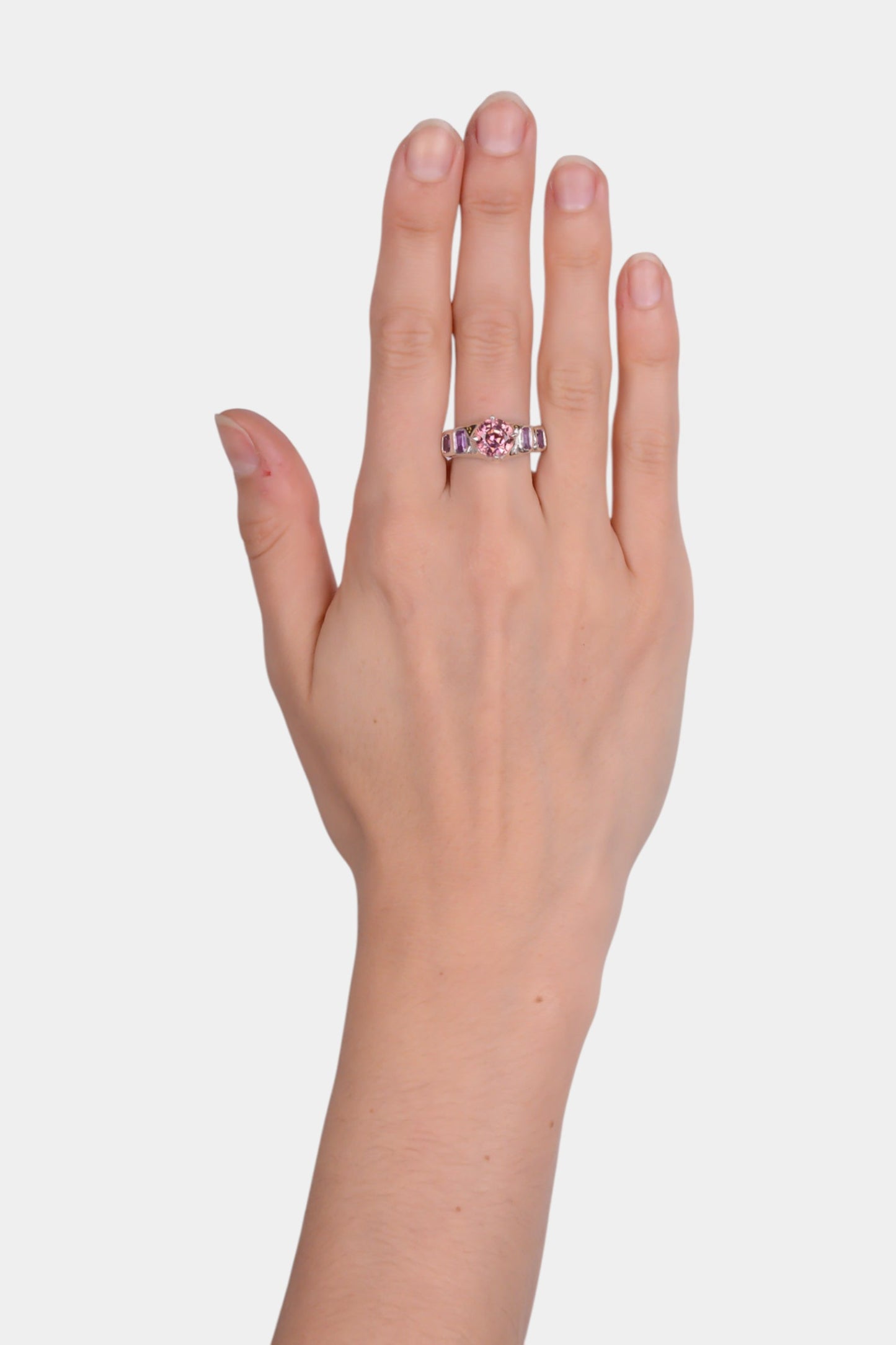 Pink Juice Ring wearing on home
sterling silver
~ 8mm round cut pink tourmaline
~ two 4.5x3mm emerald cut purple sapphire
~ two 3.5x3mm emerald cut purple sapphire